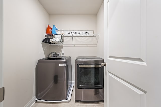 washroom with washing machine and dryer