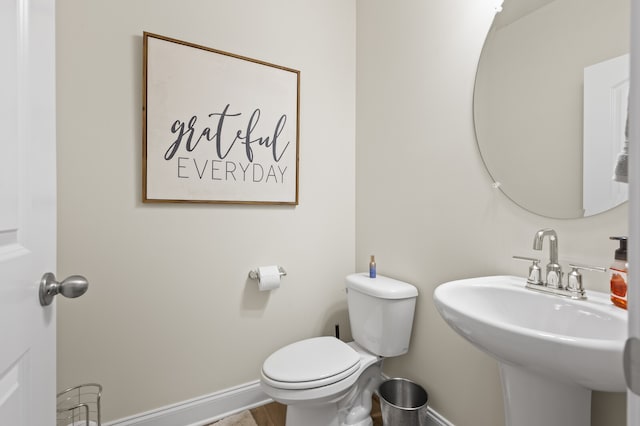 bathroom with toilet and sink