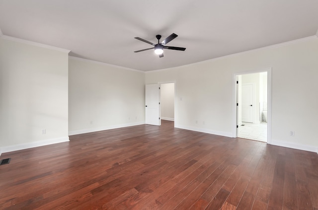 empty room featuring ceiling fan, ornamental molding, and dark hardwood / wood-style flooring