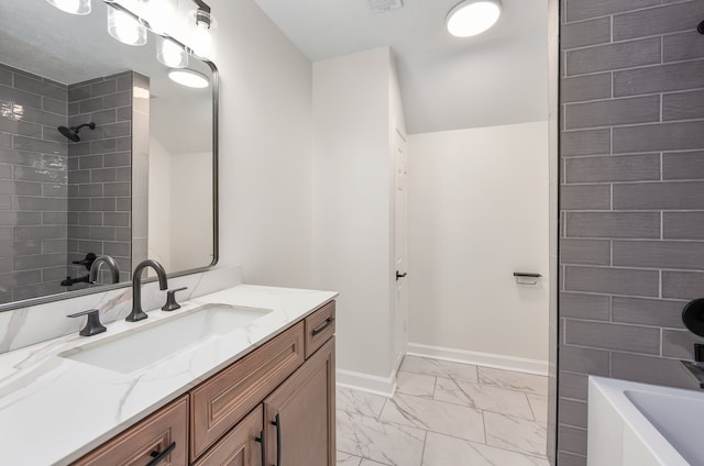 bathroom with vanity and tiled shower / bath