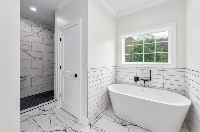 bathroom featuring crown molding, shower with separate bathtub, and tile walls