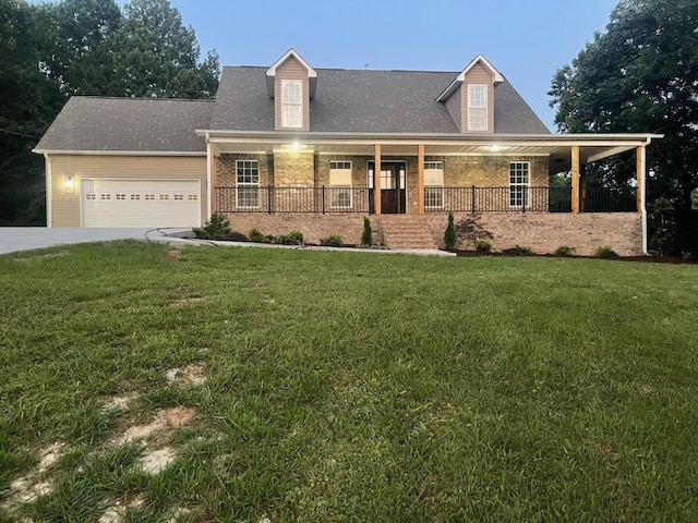 cape cod home featuring a garage, a front lawn, and a porch