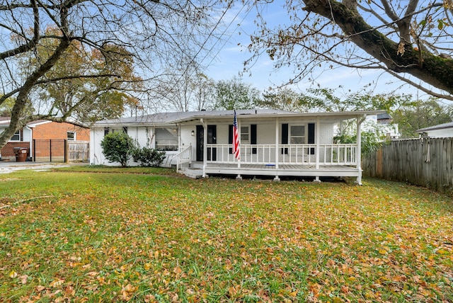 view of front facade featuring a front lawn and covered porch