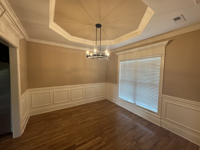 unfurnished room with a chandelier, a raised ceiling, dark hardwood / wood-style floors, and crown molding