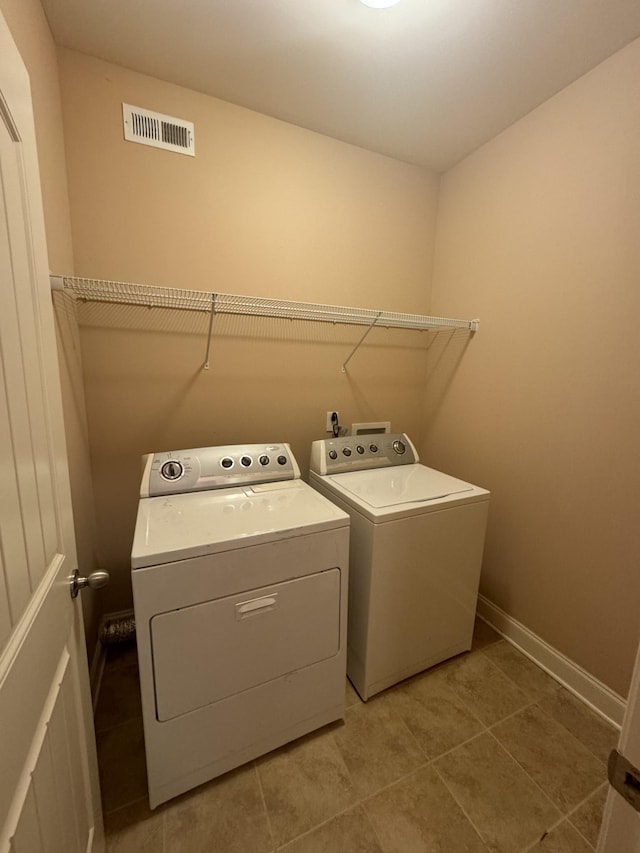 3213 Shady Forest Dr, Murfreesboro, TN 37128 - laundry area with washer and dryer and light tile patterned flooring