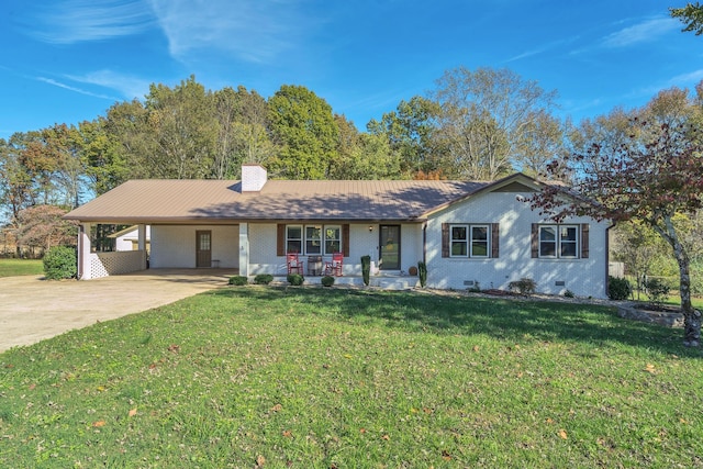 ranch-style home with covered porch, a front lawn, and a carport