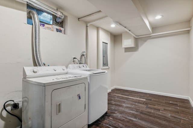 laundry area with dark wood-type flooring and washing machine and clothes dryer