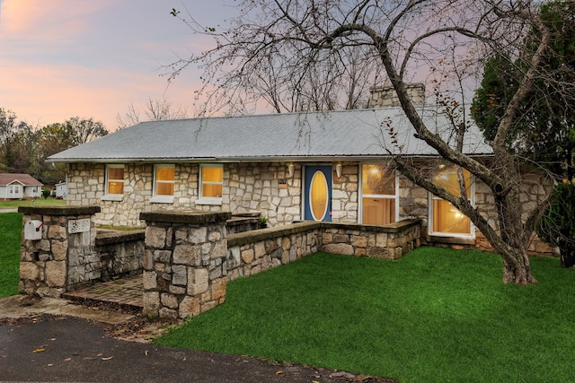 view of front of house with a lawn