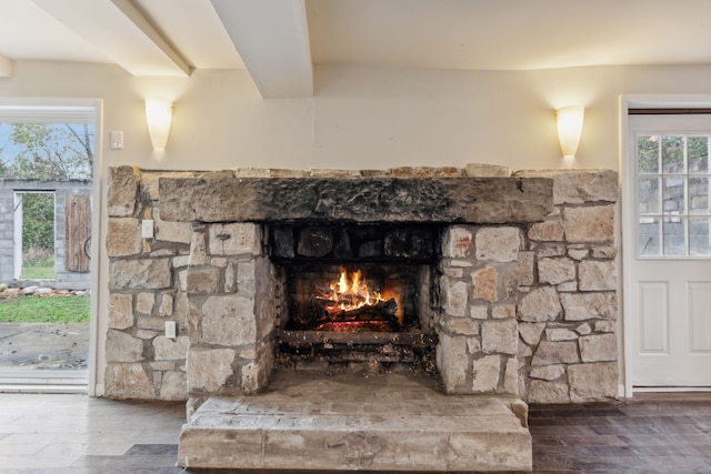 details with a fireplace and wood-type flooring