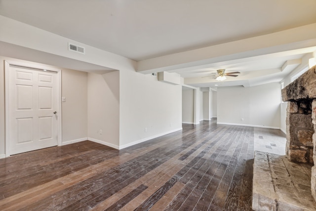 unfurnished living room with dark hardwood / wood-style floors and ceiling fan