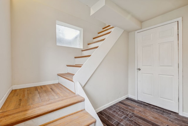 stairs with hardwood / wood-style floors