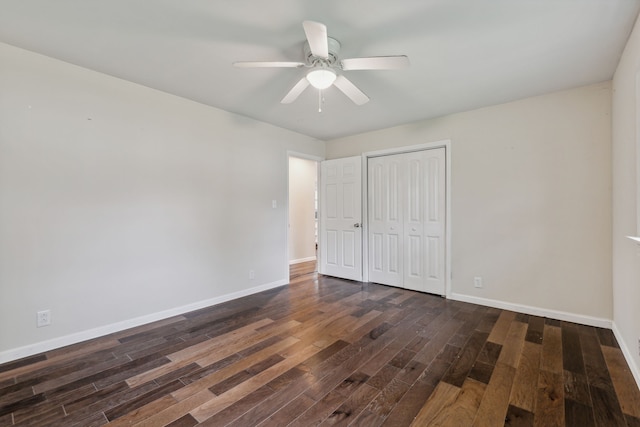 unfurnished bedroom featuring ceiling fan, a closet, and dark hardwood / wood-style flooring