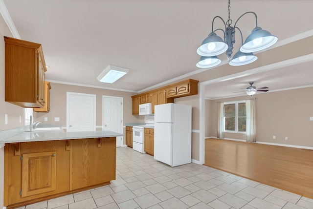 kitchen featuring ceiling fan with notable chandelier, sink, ornamental molding, light wood-type flooring, and white appliances