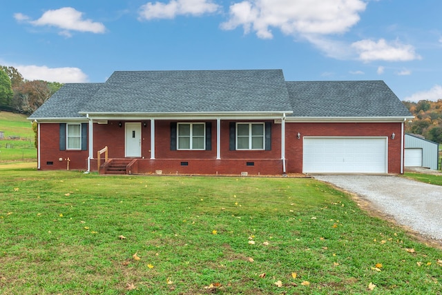 ranch-style house with a garage, a front lawn, and covered porch