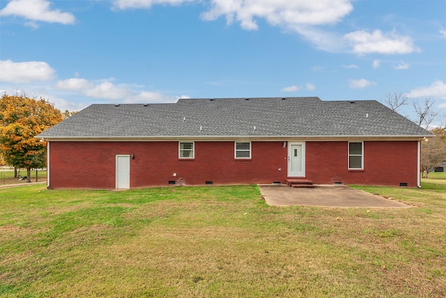 back of house featuring a patio area and a lawn