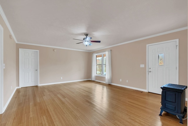 interior space featuring light wood-type flooring, ceiling fan, and ornamental molding