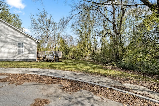 view of yard with a wooden deck