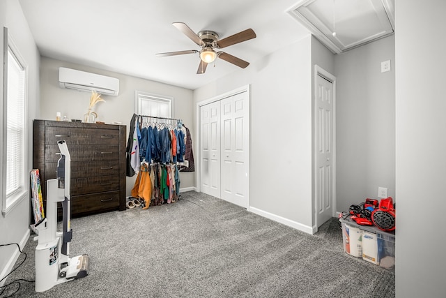 bedroom featuring a closet, ceiling fan, an AC wall unit, and carpet