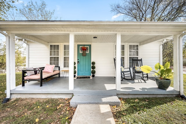 doorway to property featuring covered porch