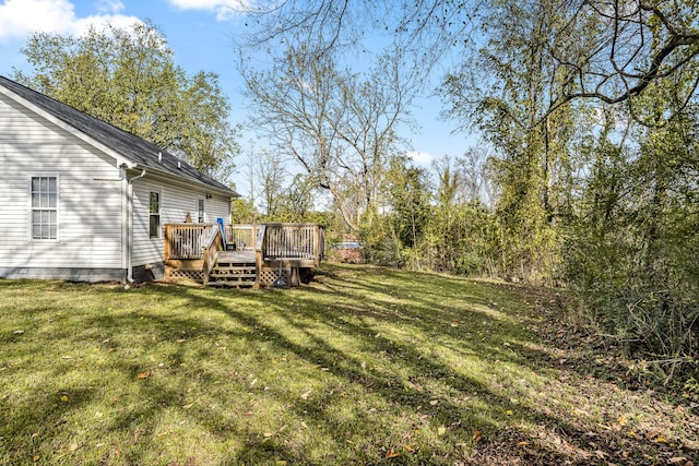 view of yard with a wooden deck