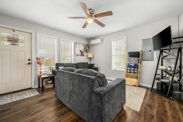 living room with electric panel, ceiling fan, dark wood-type flooring, and a wall mounted air conditioner