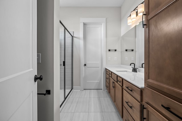 bathroom with vanity, tile patterned flooring, and a shower with shower door