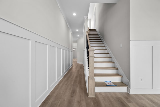 stairway featuring wood-type flooring