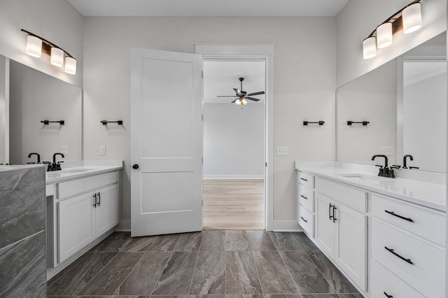 bathroom featuring hardwood / wood-style flooring, ceiling fan, and vanity