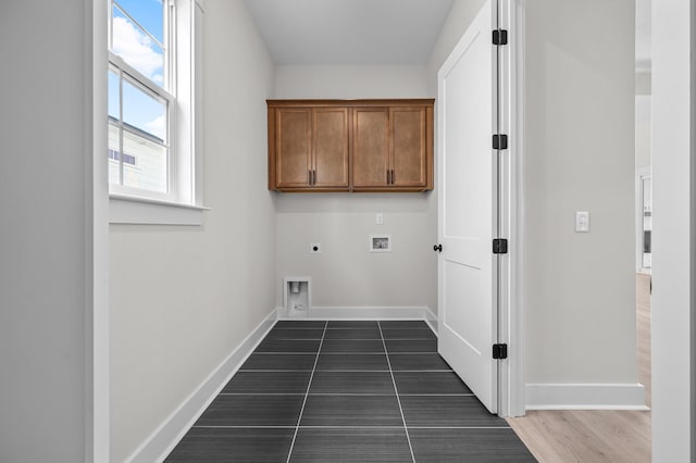 laundry room featuring hookup for an electric dryer, washer hookup, cabinets, and dark hardwood / wood-style floors