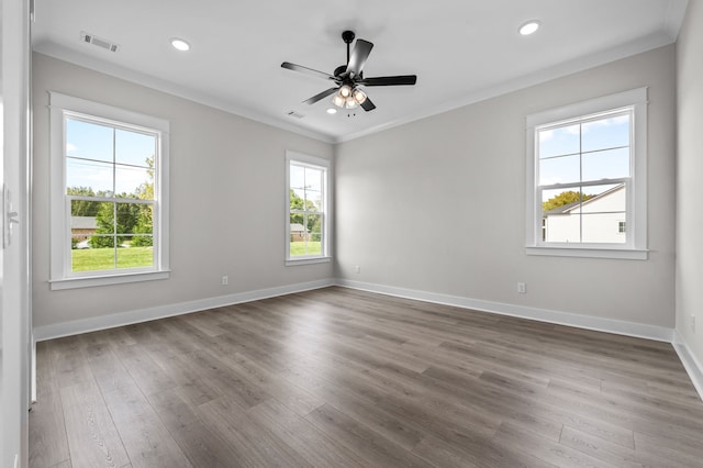 unfurnished room featuring dark hardwood / wood-style floors and plenty of natural light