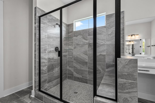 bathroom featuring vanity and an enclosed shower