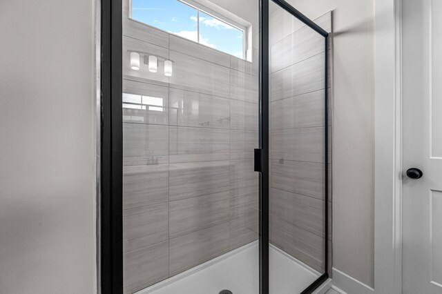 bathroom featuring an enclosed shower