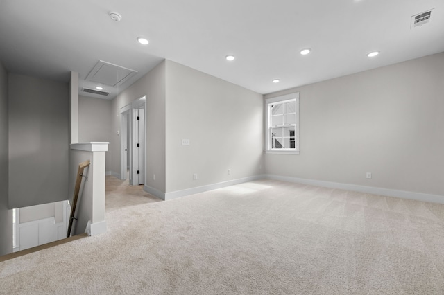 unfurnished room with light carpet