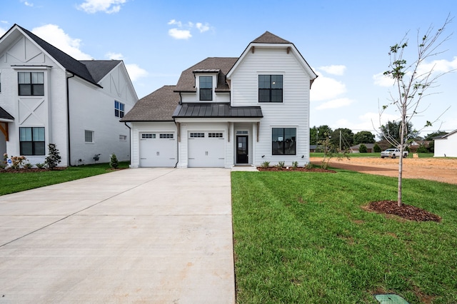 view of front facade featuring a garage and a front yard