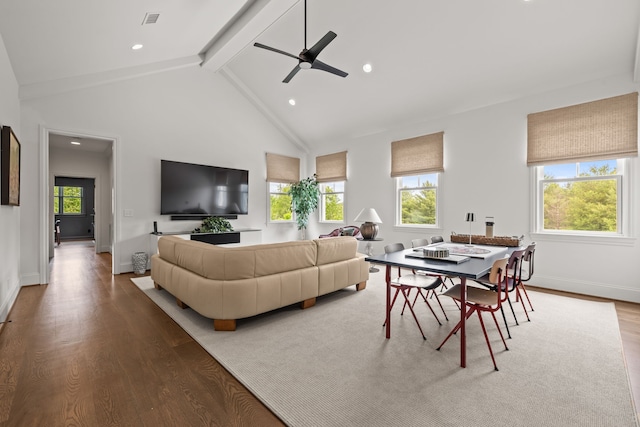 living room with beamed ceiling, hardwood / wood-style flooring, ceiling fan, and high vaulted ceiling