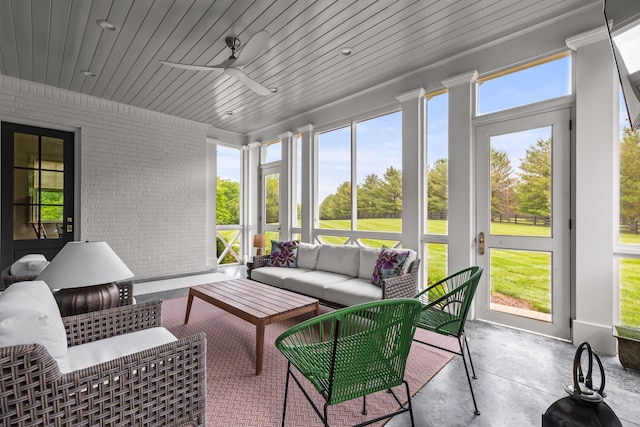 sunroom / solarium with ceiling fan and wood ceiling