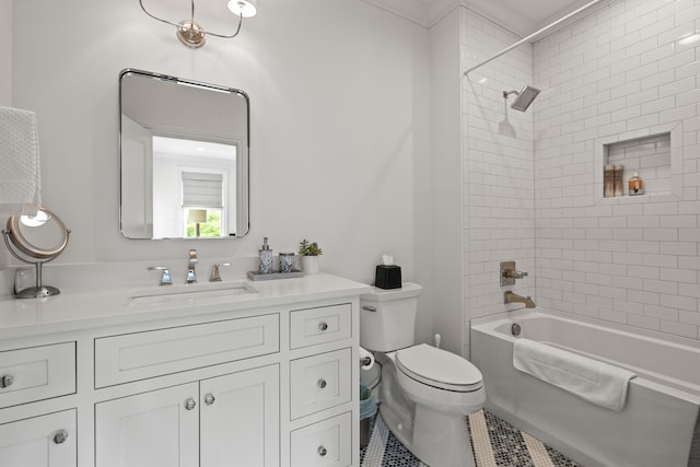 full bathroom with vanity, crown molding, tile patterned floors, toilet, and tiled shower / bath combo