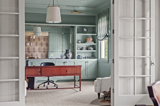 office area featuring carpet floors and crown molding