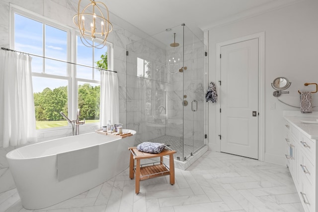 bathroom with a wealth of natural light, an inviting chandelier, separate shower and tub, and crown molding