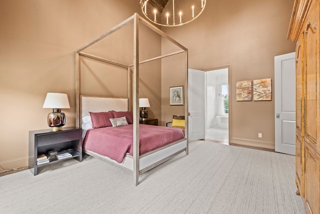 bedroom with a notable chandelier and ensuite bathroom