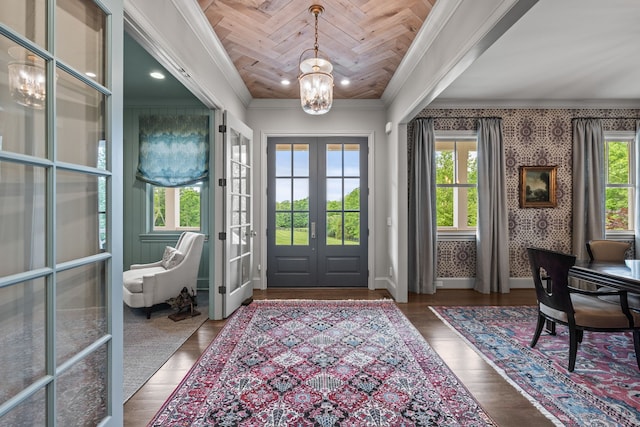 doorway to outside with a chandelier, a wealth of natural light, french doors, and wood-type flooring