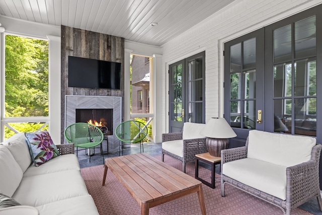 view of patio / terrace featuring an outdoor living space with a fireplace