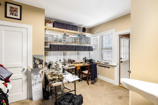 carpeted home office with baseboards