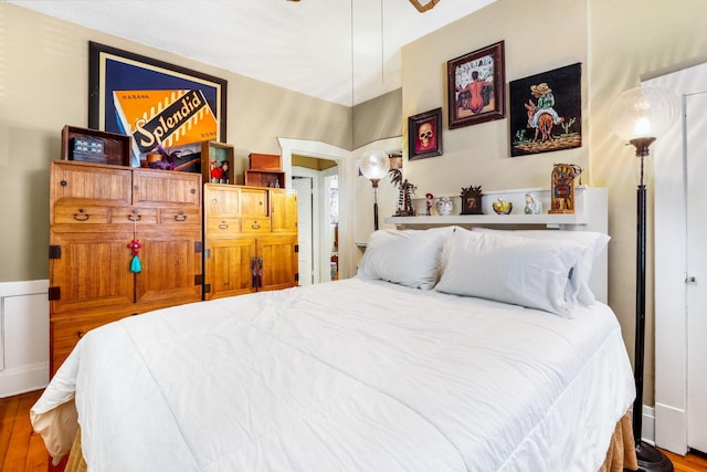bedroom with wood finished floors