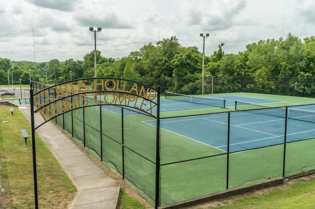 view of tennis court with fence