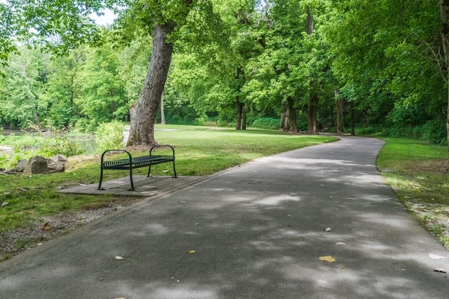 surrounding community featuring a yard