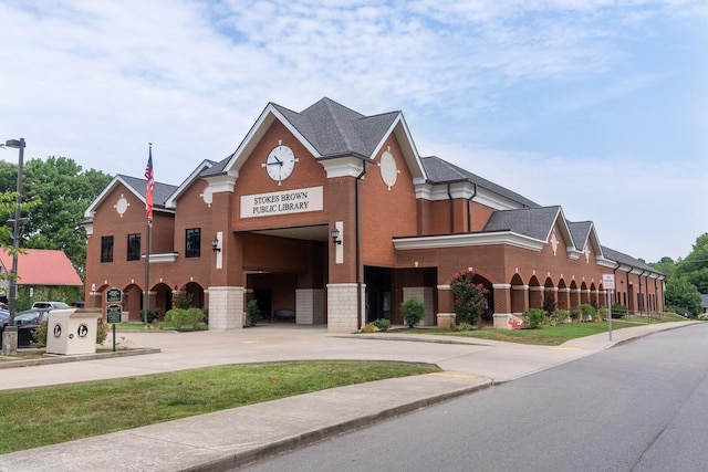 view of building exterior with driveway