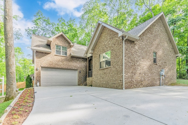 view of side of property with a garage