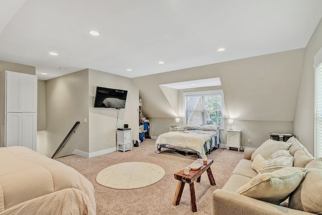 bedroom featuring vaulted ceiling and light carpet