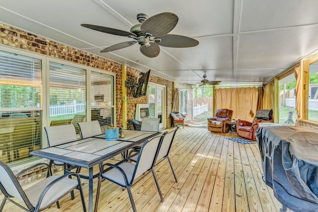 sunroom featuring ceiling fan